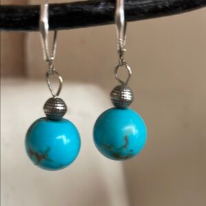 Beautiful sterling silver earrings with spherical  turquoise bead